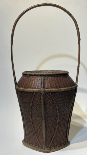 Waisted vase form hoop handle basket