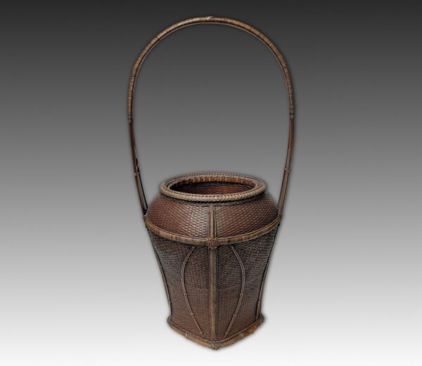 Waisted vase form hoop handle basket